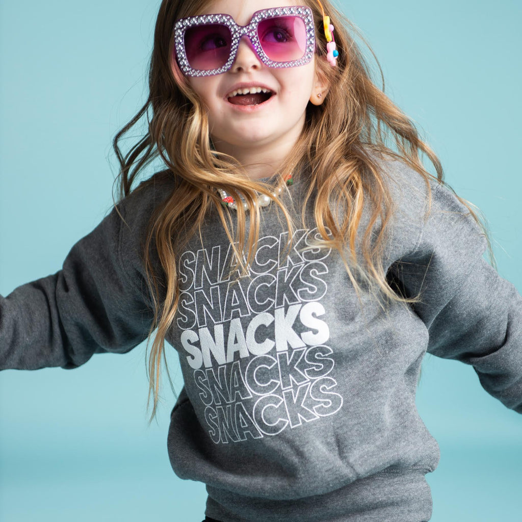 girl wearing our kid's Snacks Crewneck Sweatshirt
