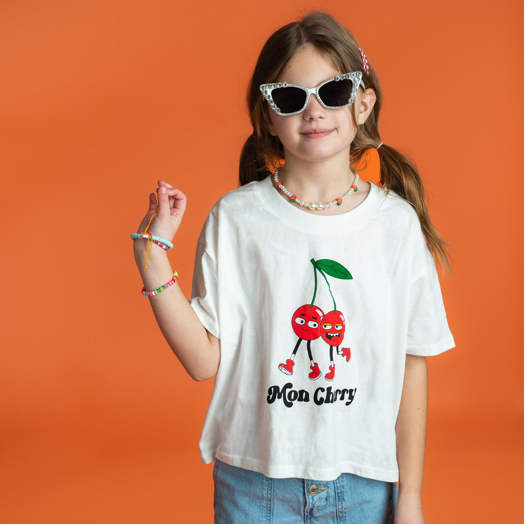 Girl wearing a Mon Cherry Tee and cute accessories from Little Chicken