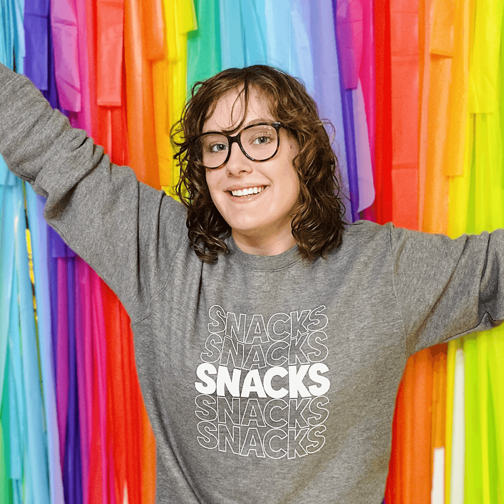 lady wearing a Snacks Crewneck Sweatshirt