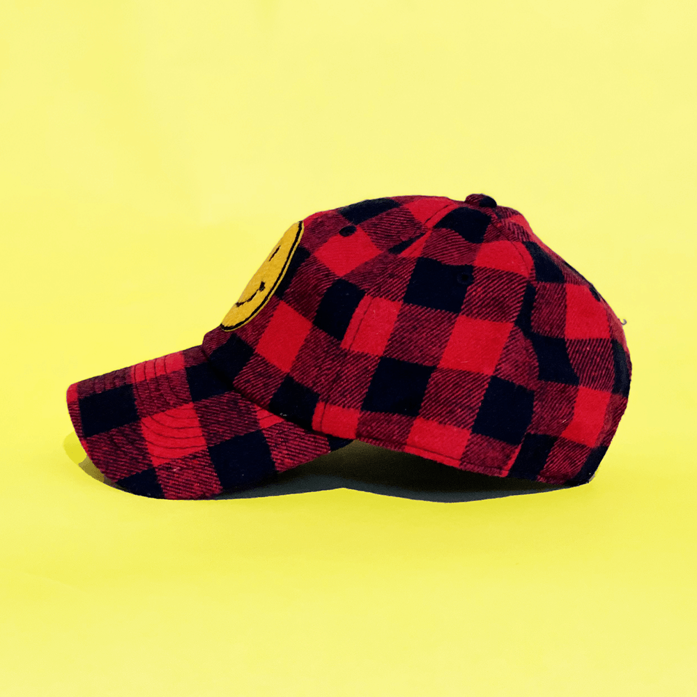 Buffalo plaid trucker hat with one patch
