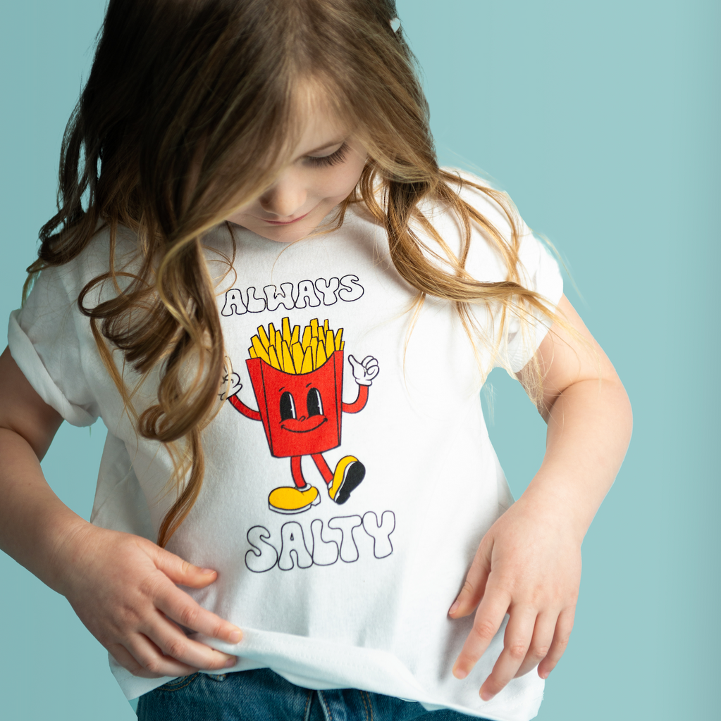 little girl wearing the french fries "always salty" t-shirt