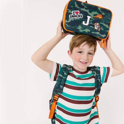 boy with camo lunchbox and backpack