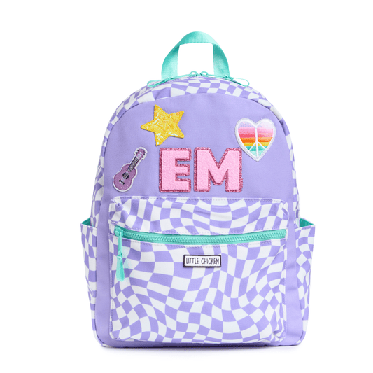 Purple checkered backpack with colorful patches on a white background