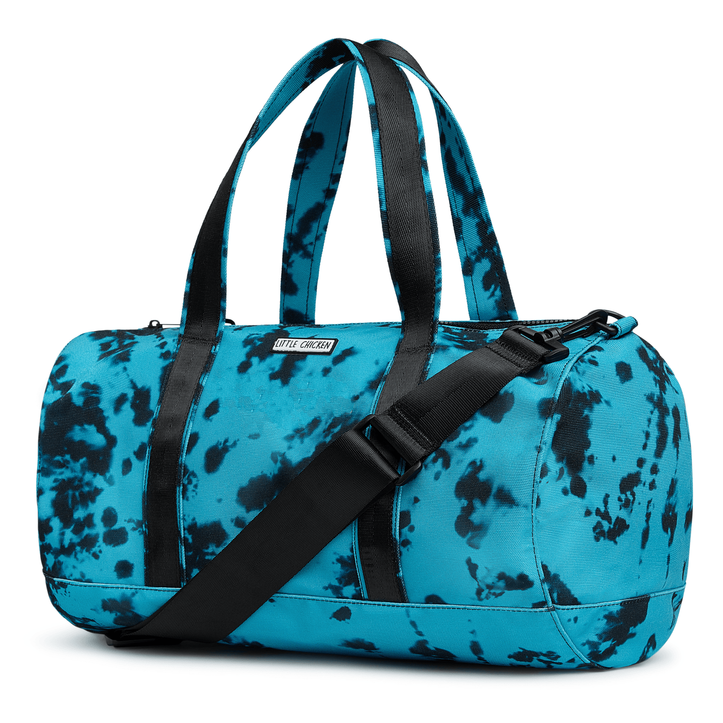 Blue and black tie dye duffel bag with a black strap on a white background