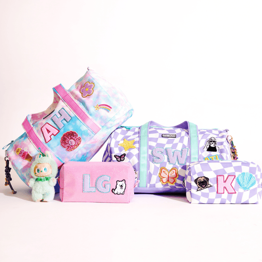 Set of colorful custom  duffels and pouches with patches  on a white background