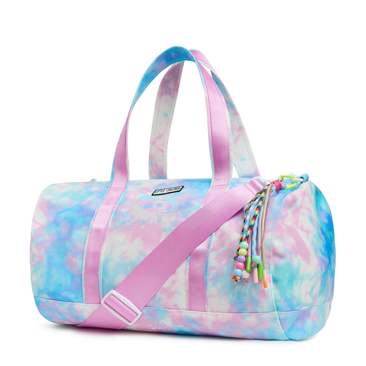 Tie-dye duffel bag with pink straps on a white background