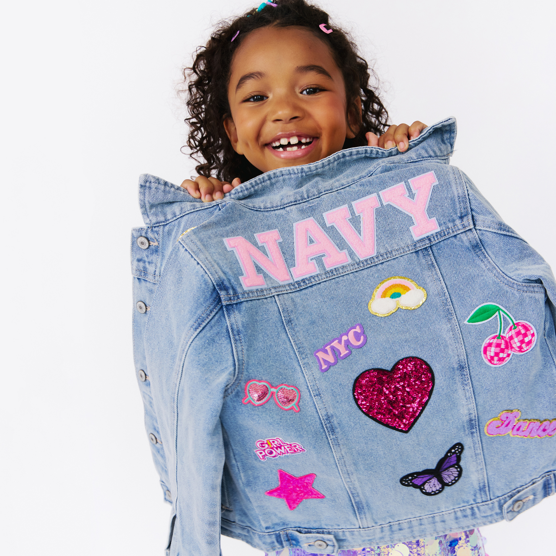 little girl wearing a denim jacket. custom kids apparel