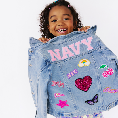little girl wearing a denim jacket. custom kids apparel