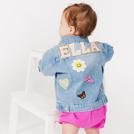 baby wearing custom infant denim jacket with patches