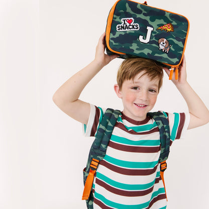 boy with camo lunchbox and backpack