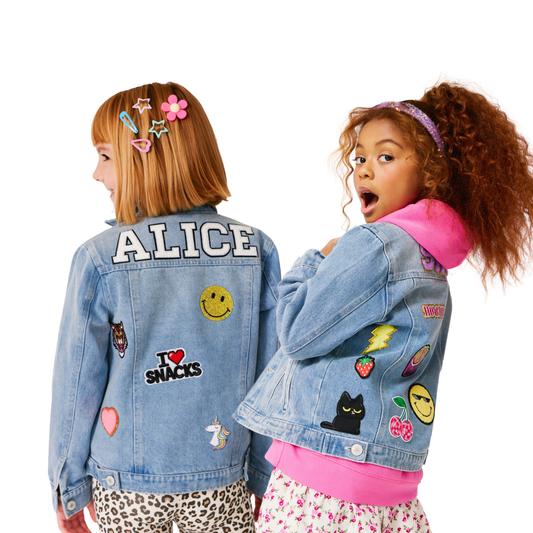 Two children wearing custom denim jackets with patches