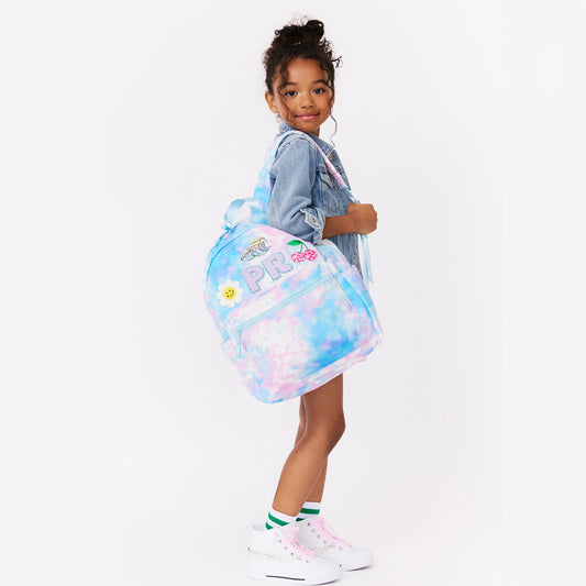 girl holding personalized pink tie dye backpack