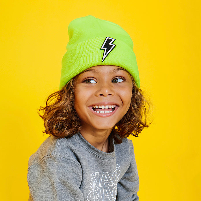 Boy in neon green beanie customized with lightning bolt patch
