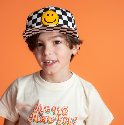 boy wearing a checkered Kids Custom Trucker Hat