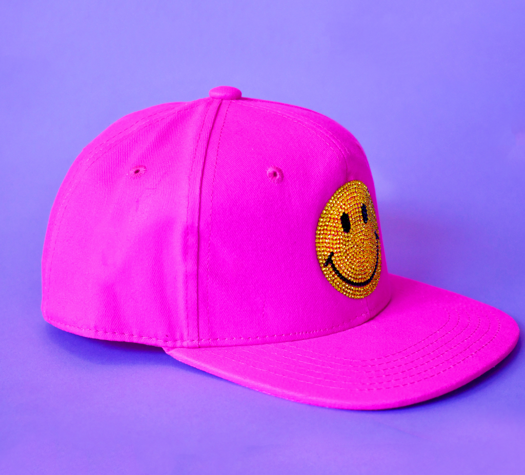 bright pink Kids Custom Trucker Hat with a smiley face