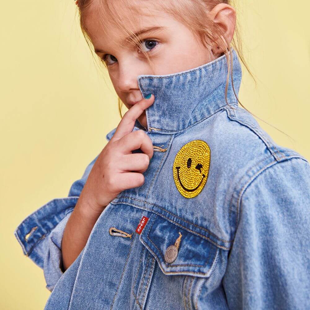 Jean jacket with crystal smiley emoji patch