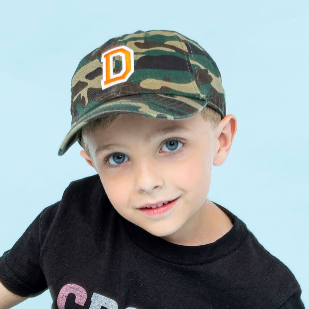 boy wearing a camouflage Kids Custom Trucker Hat